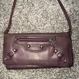 Balenciaga mauve wallet on a strap
